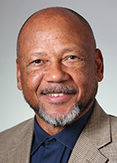 Brian Swann is a bald man with gray facial hair.
