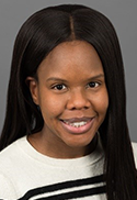Jessica Addison is wearing a white and black shirt. 