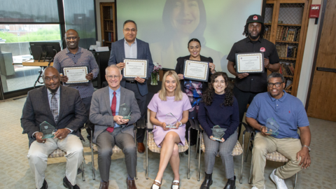 The Dean's Community Service Award recipients and organization reps sit in the Minot Room in Countway Library.