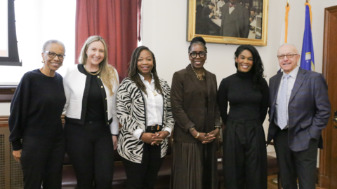 The four 2025 HMS faculty fellows pose with Joan Reede and George Daley in the Waterhouse Room.
