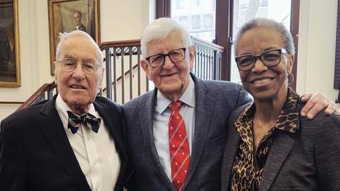 Frederick Lovejoy, Jr., Joseph B. Martin, and Joan Reede stand for a photo in the Waterhouse Room.
