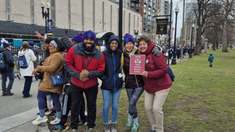 The Harvard Longwood team stands in Boston Common, huddled together in the cold.