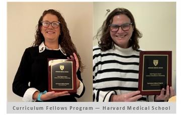 HMS Curriculum Fellows each hold their award.