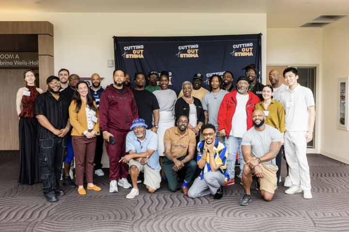 Aima Ahonkai stands with the MGH Medical Practice Evaluation Center team, Tennessee team, and Nashville Cutting Out Stigma barbers who are all involved in the program.