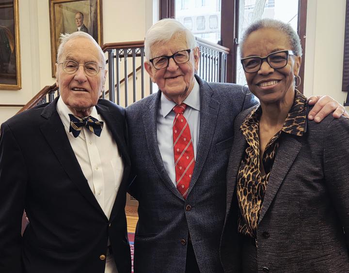 Frederick Lovejoy, Jr., Joseph B. Martin, and Joan Reede stand for a photo in the Waterhouse Room.