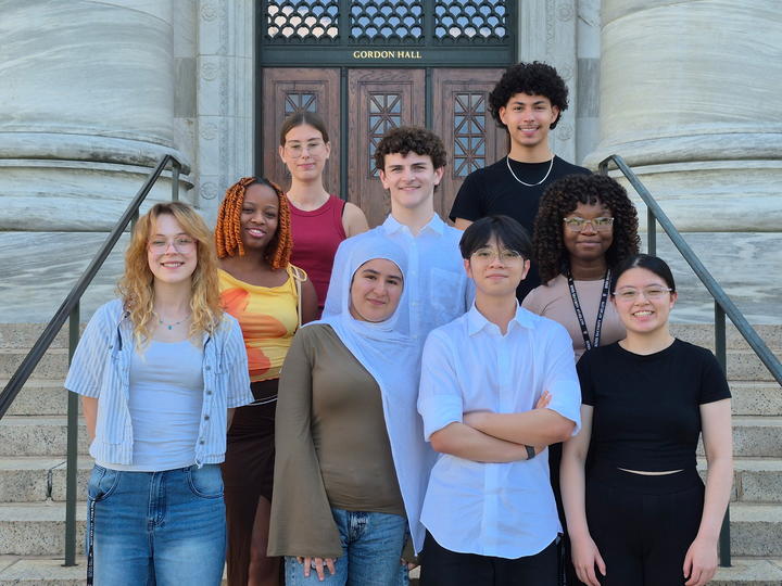 The 2026 Project Success cohort of 8 students stand outside Gordon Hall on the steps.