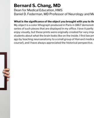 Bernard Chang is holding up a framed lithograph of a brain.