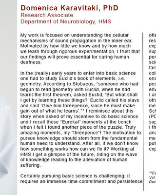 Domenica Karavitaki is wearing a white lab coat with "Neurobiology" embroidered in red on it.