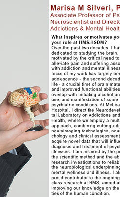 Marisa Silveri is holding a miniature neuroanatomical model of the human brain. 